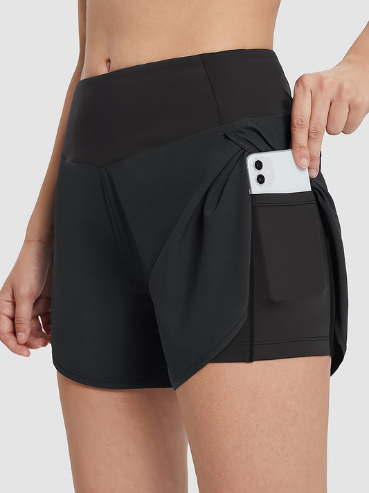 Woman wearing high-waisted running shorts with secure pocket